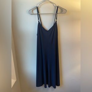 Blue Calvin Klein slip dress with gold accents in the strap and back zipper
